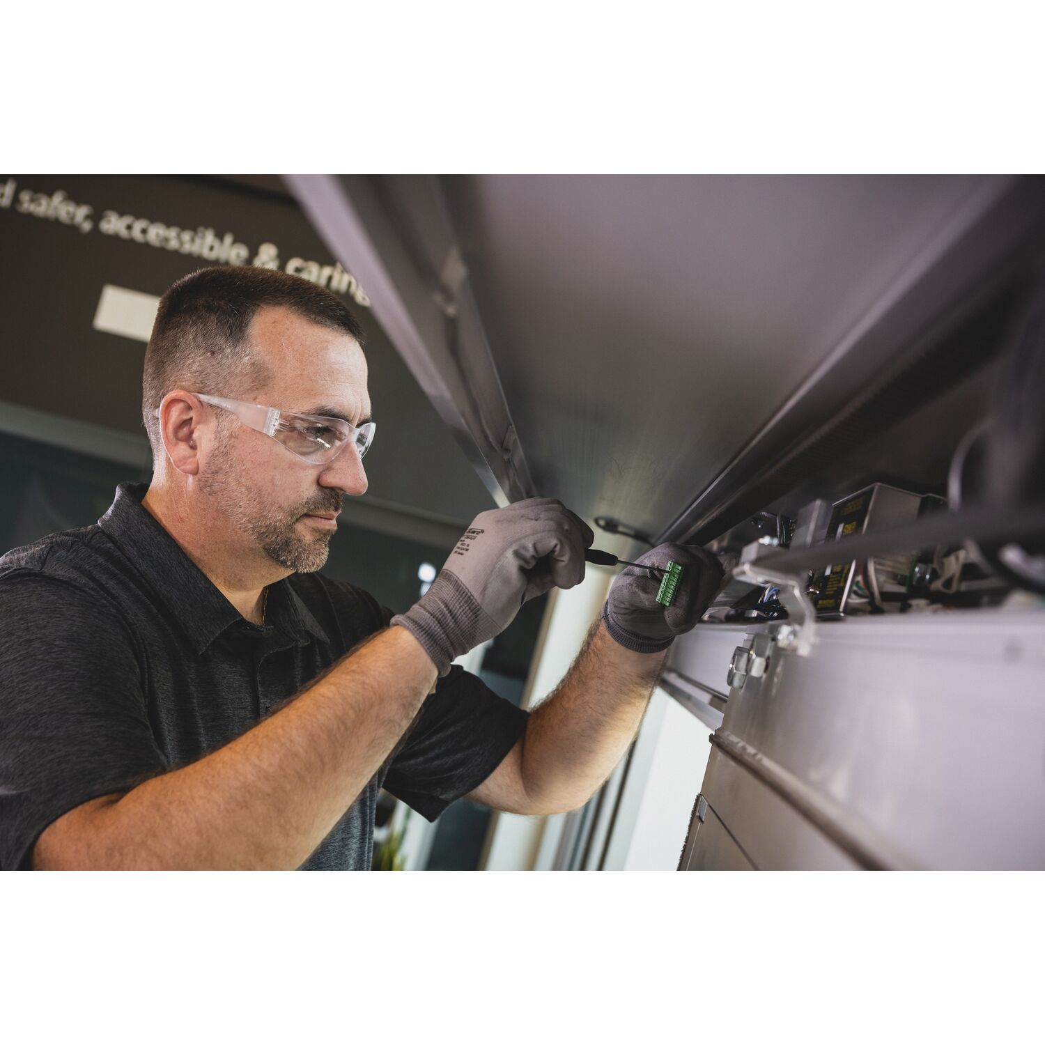 Ecomm_Medium-SAT - Fishers, IN - Technician Servicing Door.jpg Service Tech