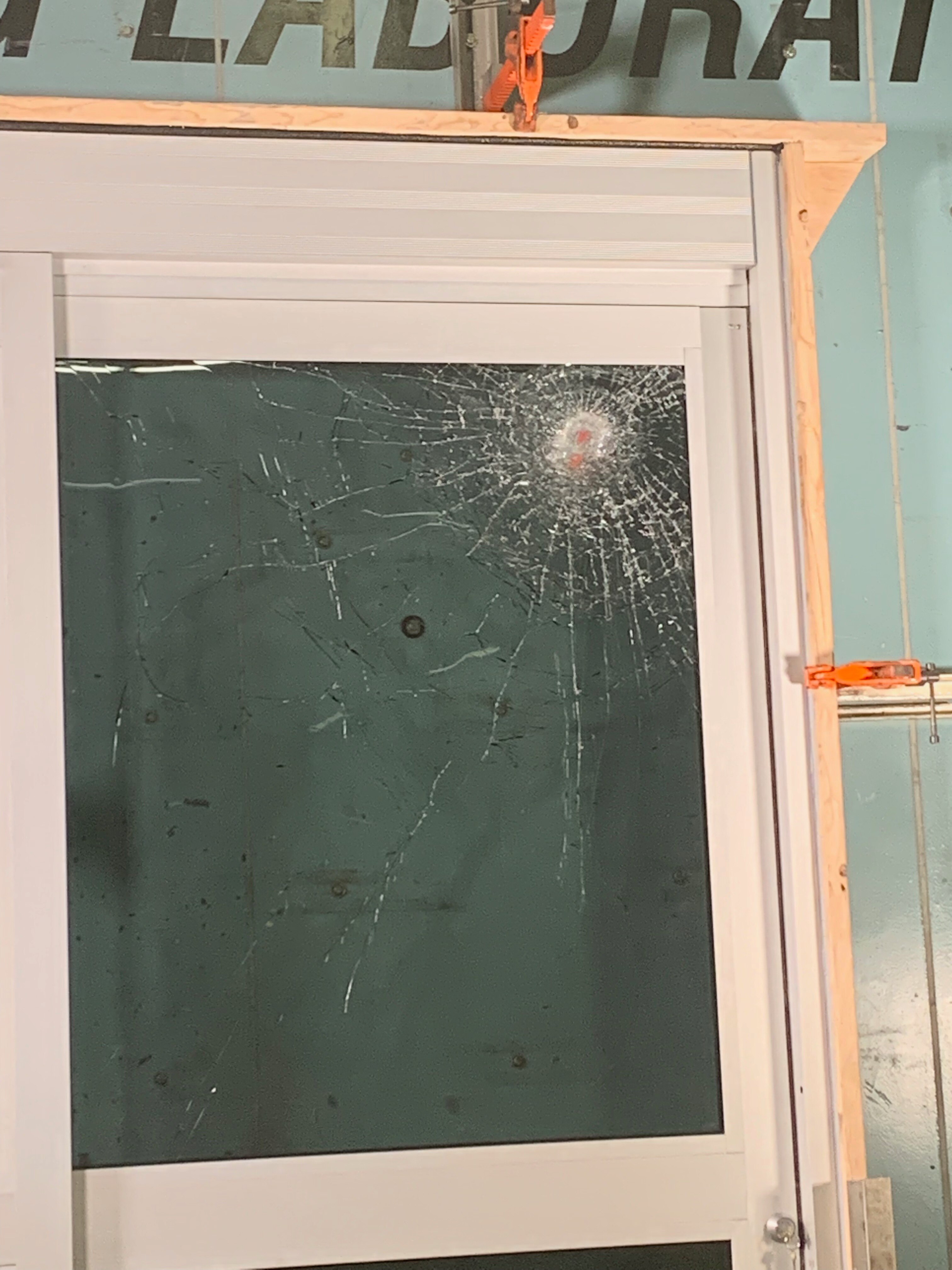 Dura-Storm After Missile Impact Cracked Dura-Storm with Cracked Glass After Missile Impact Test
