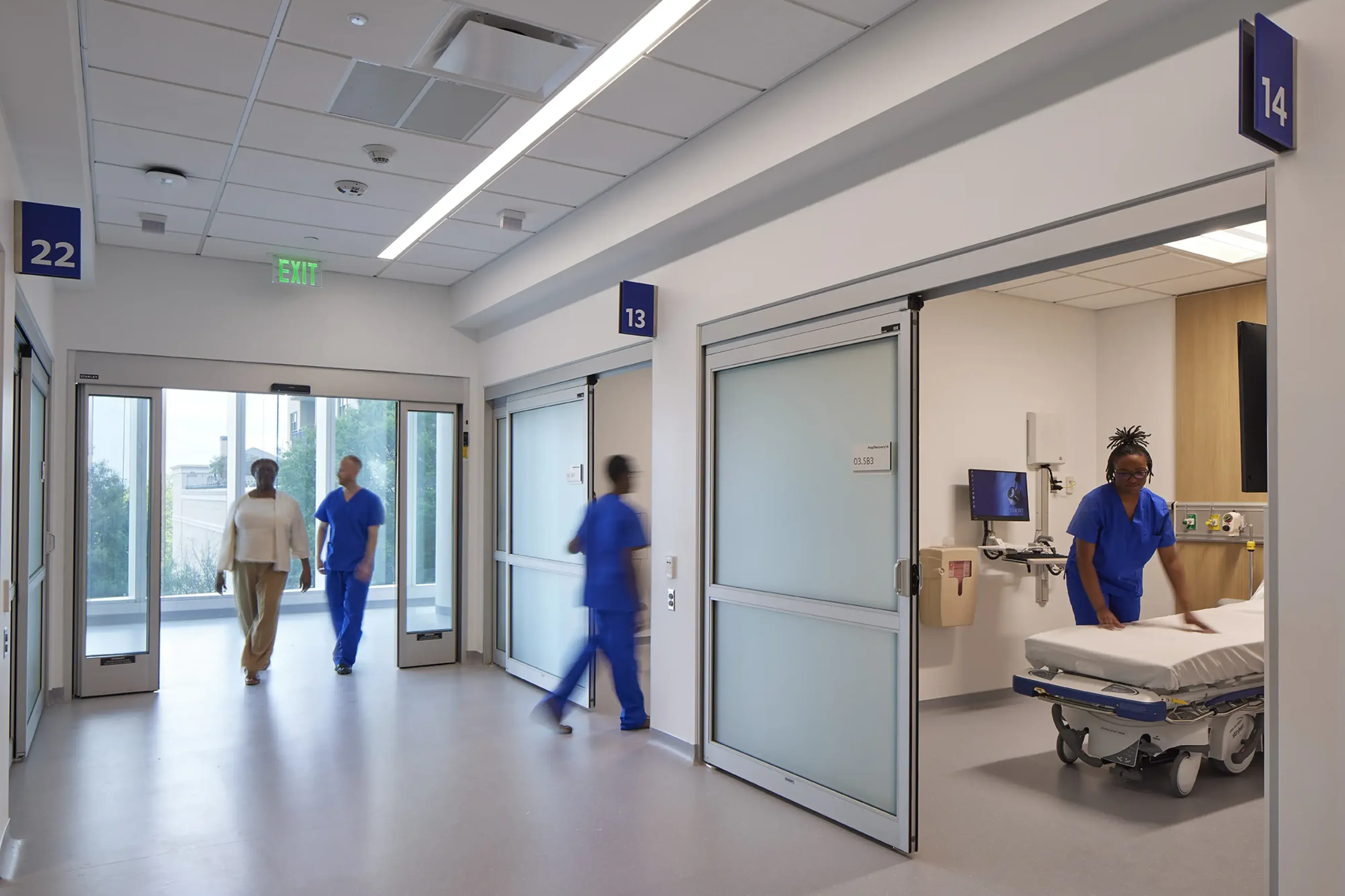 healthcare corridor with staff working