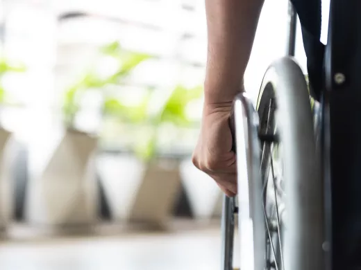 A closeup of a wheelchair wheel.