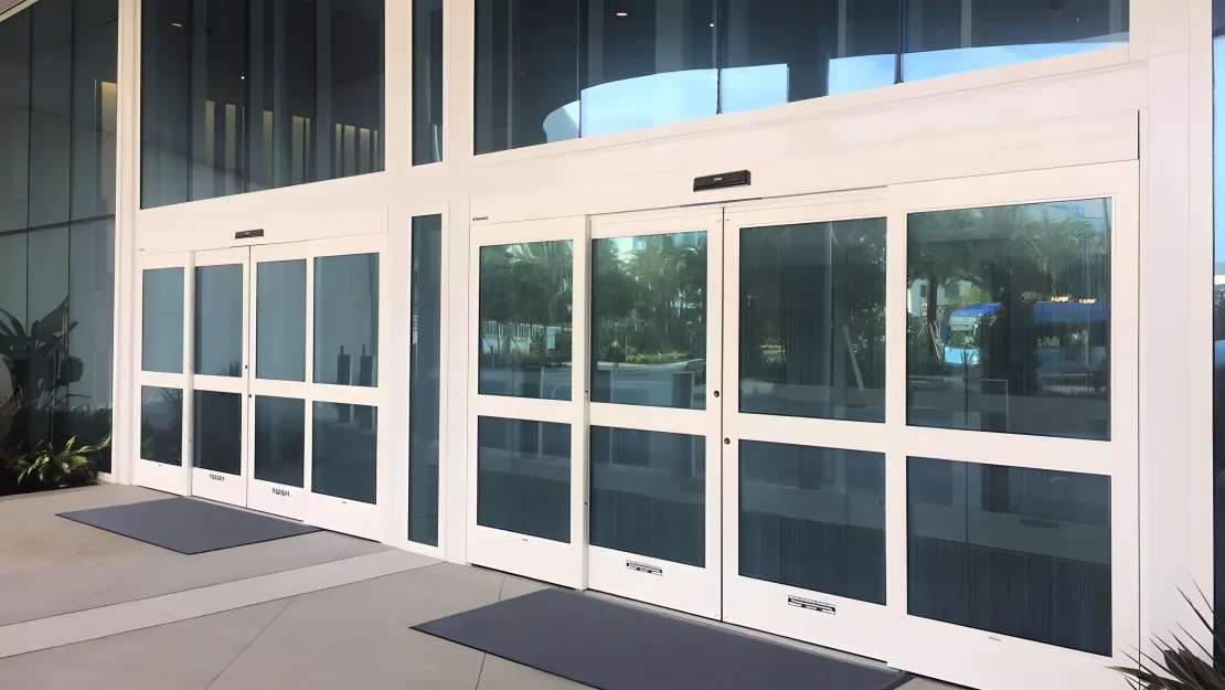 A forced entry resistant automatic sliding door on a retail store front