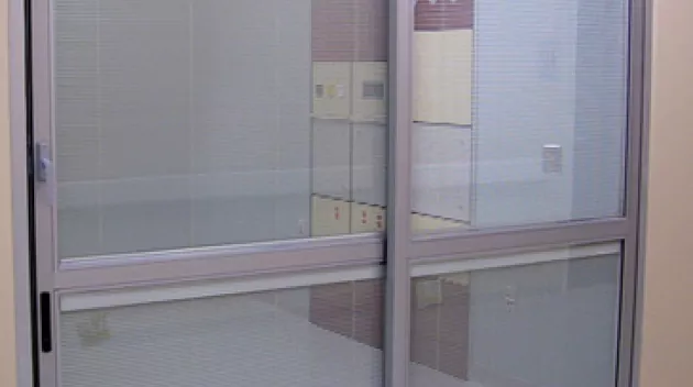 A set of doors in a hospital room.