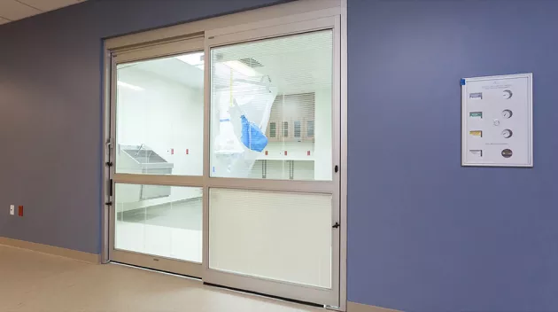 A set of doors in a hospital room.