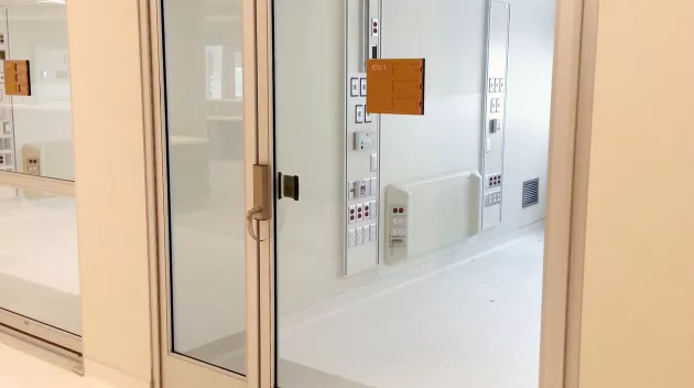 A set of doors in a hospital room.