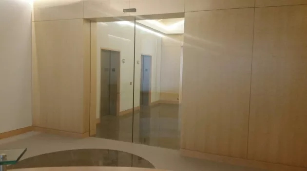 A set of glass doors in an office.