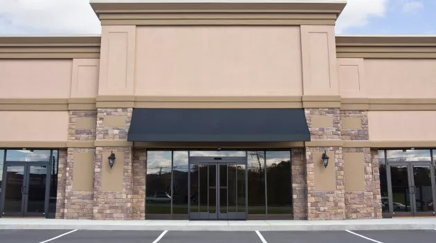 A set of closed doors at a store.