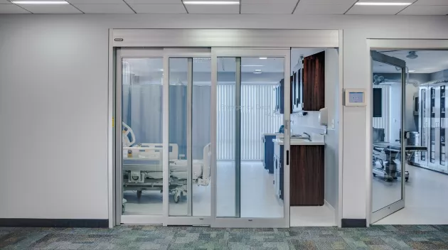 A set of sliding doors in a hospital room.