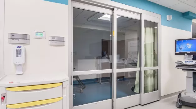 A set of sliding doors in a hospital room.