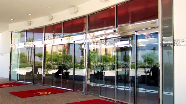 a set of all glass doors at a casino.