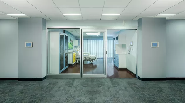 A set of sliding doors in a hospital room.