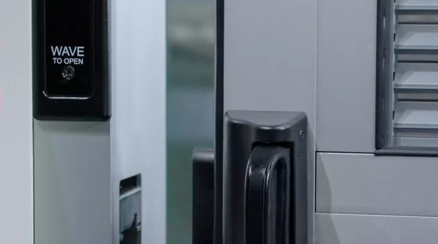 A view of a door opening sensor and the door latch.