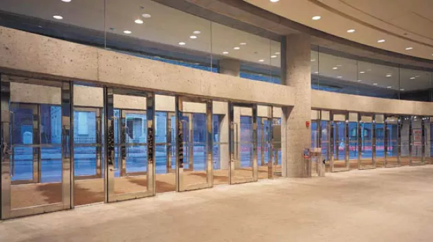 Interior of building with glass balanced doors.