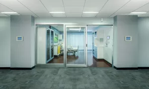 A set of sliding doors in a hospital room.