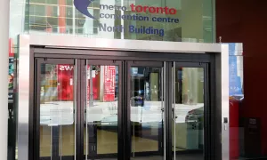 Building entrance with set of balanced manual doors.
