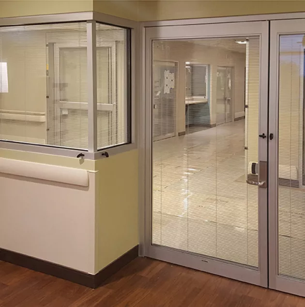 A set of doors in a hospital room.