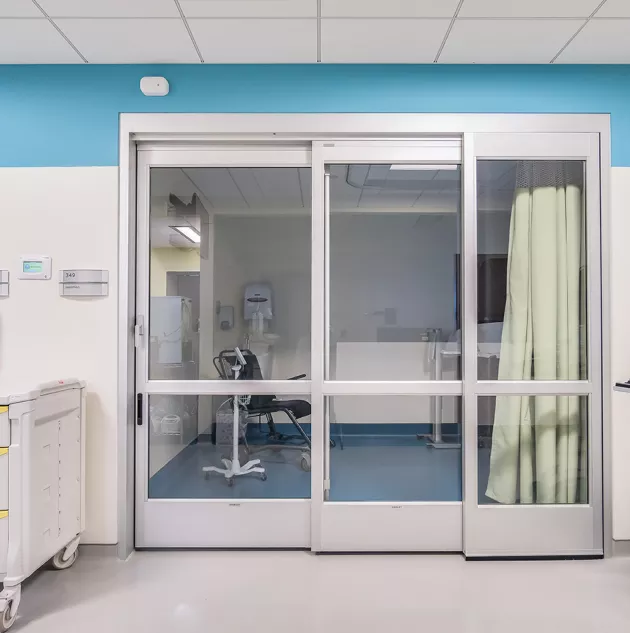 A set of doors in a hospital room.