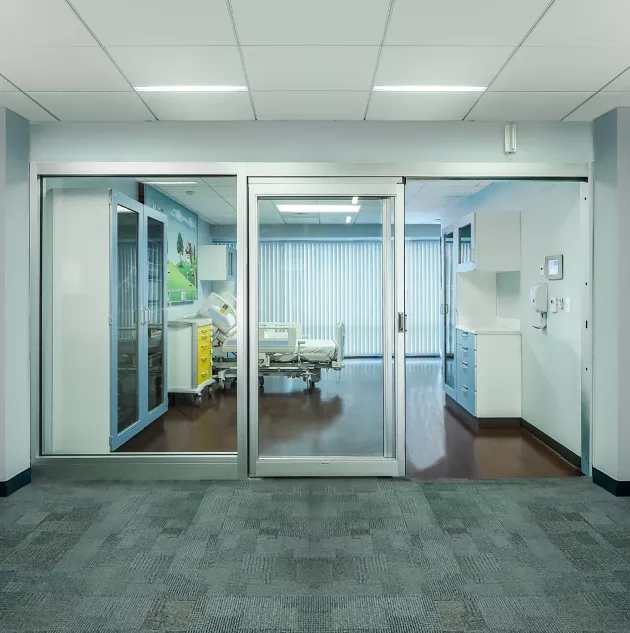 A set of sliding doors in a hospital room.