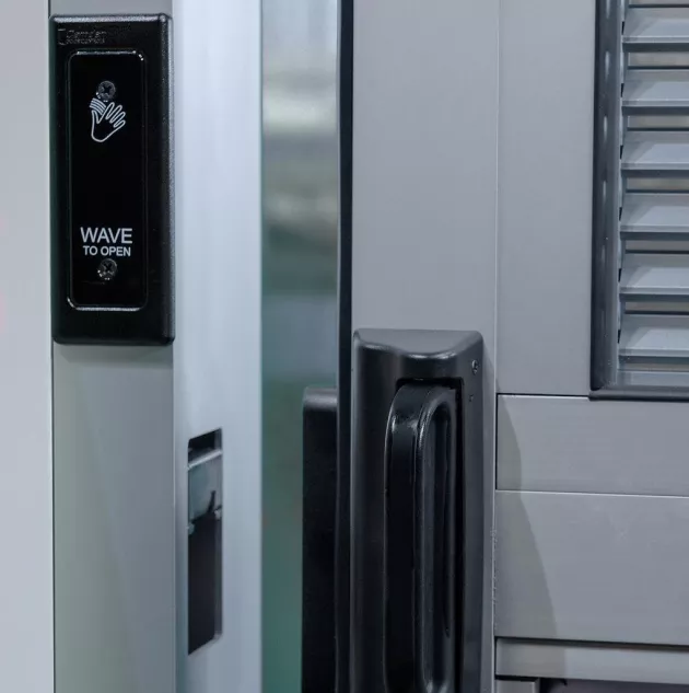 A view of a door opening sensor and the door latch.