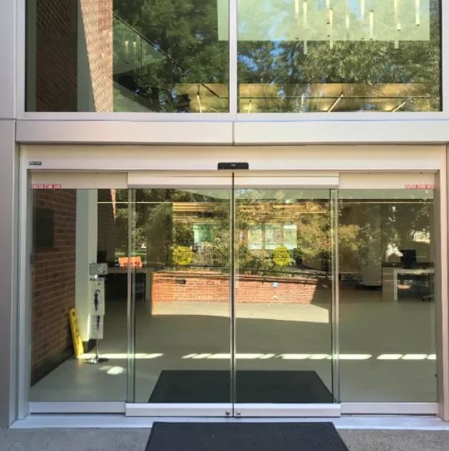 A set of all glass doors at a bank.