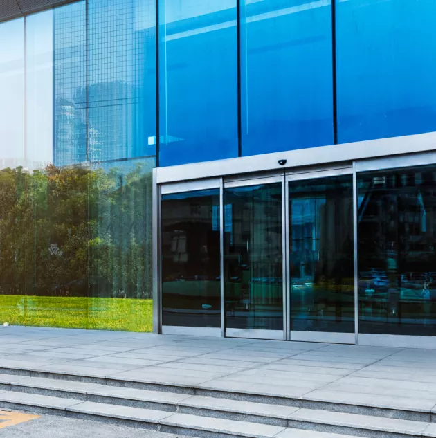 STANLEY Dura-Glide GreenStar Cropped.jpg exterior of building with automatic slide doors.