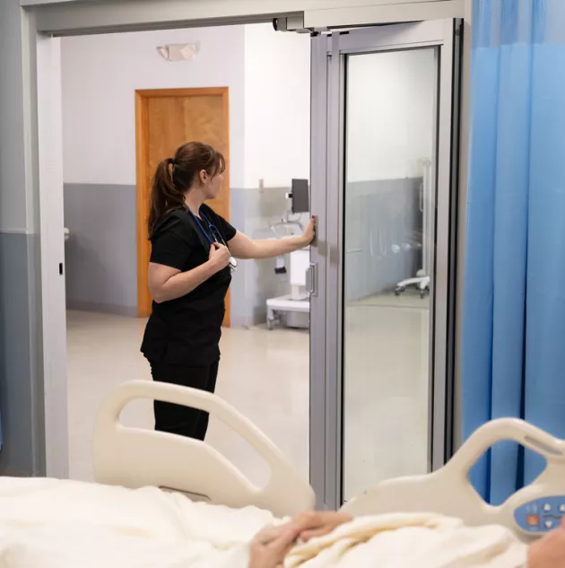 8500-nurse-break-out.jpg Nurse opening ICU door