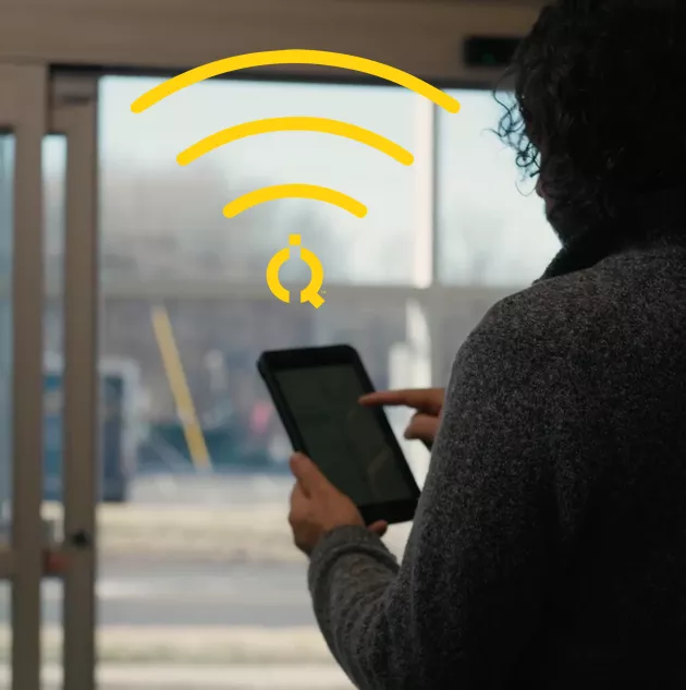 store employee with ipad for automatic sliding door