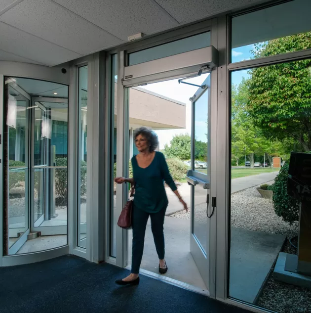 MForce-image_woman-walk-thru.jpg M-Force Swing Door Opener - Woman Walking Through Door