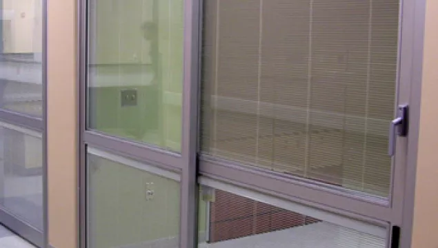 A set of doors in a hospital room.