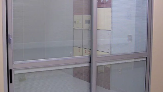 A set of doors in a hospital room.