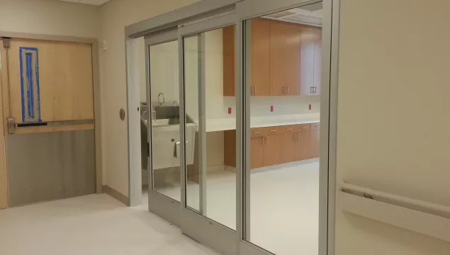 A set of doors in a hospital room.