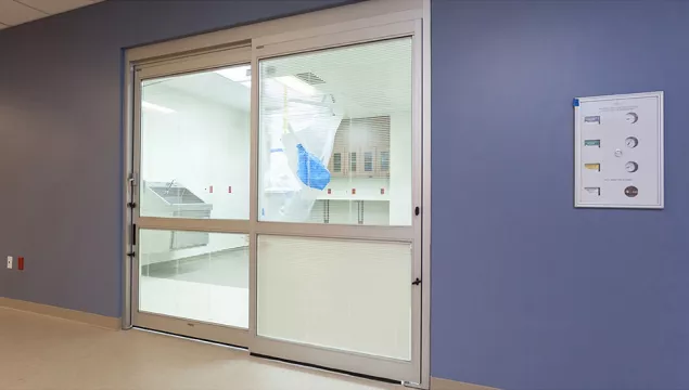 A set of doors in a hospital room.