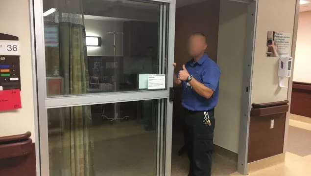 A person opening a door.