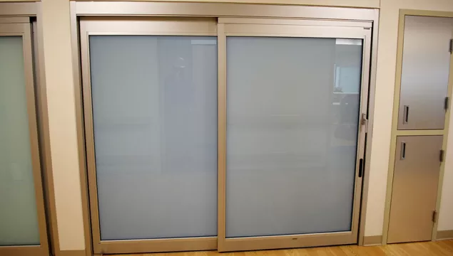 A set of doors in a hospital room.