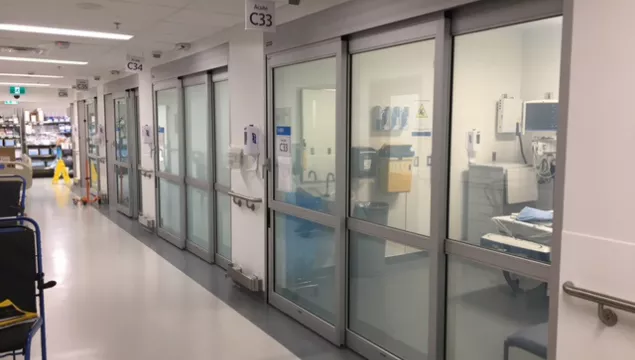 A set of doors in a hospital room.