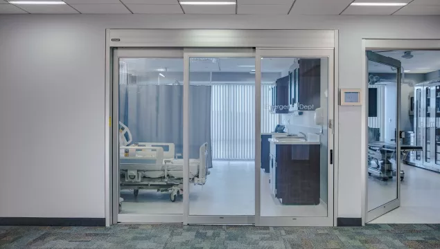 A set of sliding doors in a hospital room.