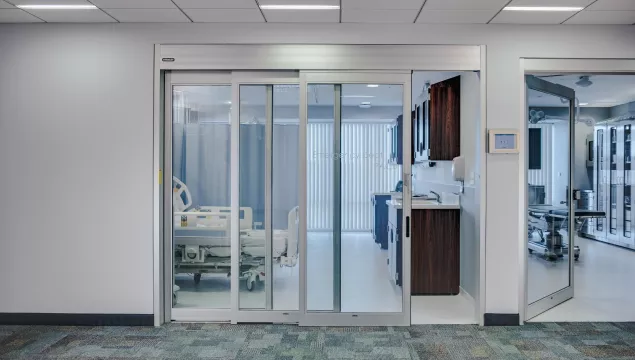 A set of sliding doors in a hospital room.