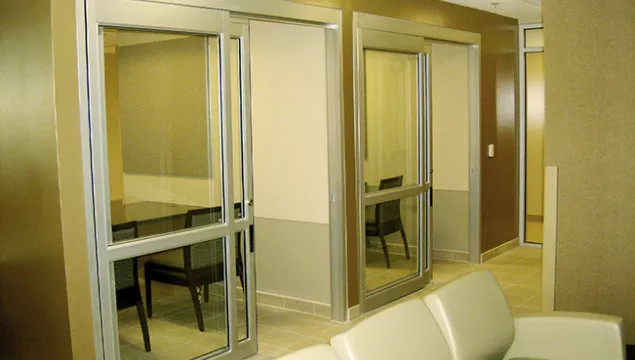 A set of doors in a hospital room.