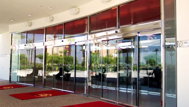 a set of all glass doors at a casino.