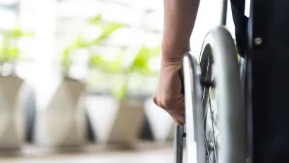 A closeup of a wheelchair wheel.