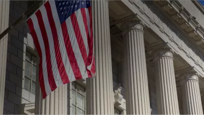 front of government building with American flag