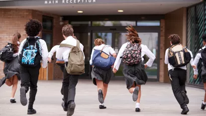 Students running into school.